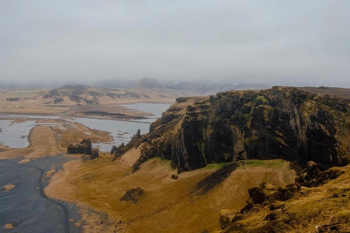 an aerial view of a mountain with a river