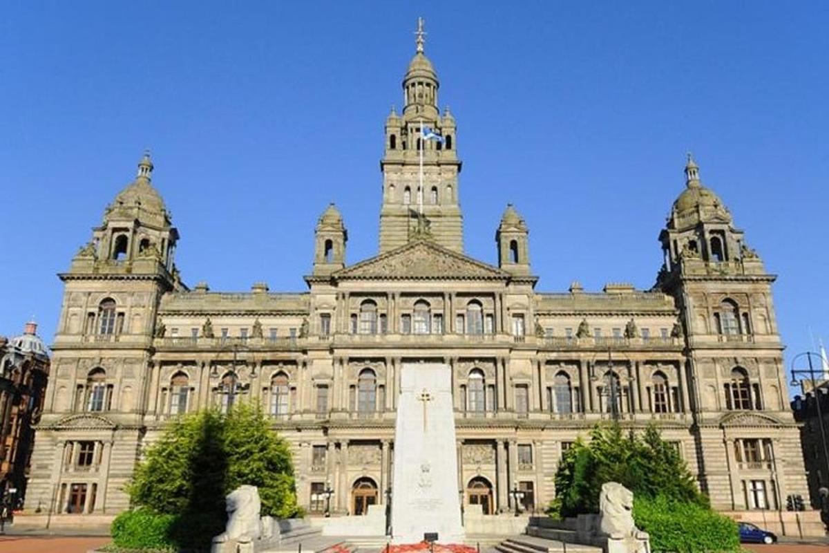 a large building with a monument in front of it