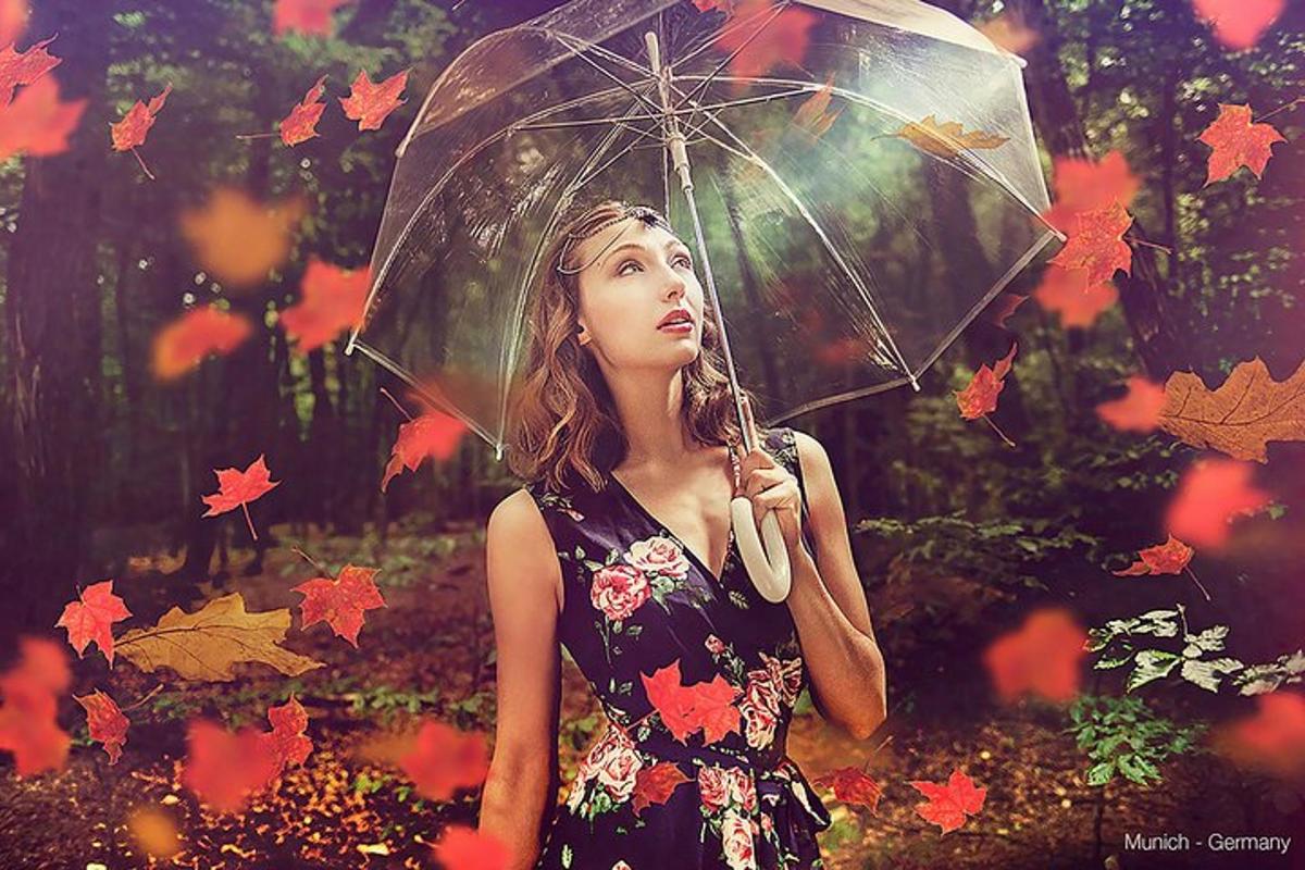 a woman holding an umbrella in the rain