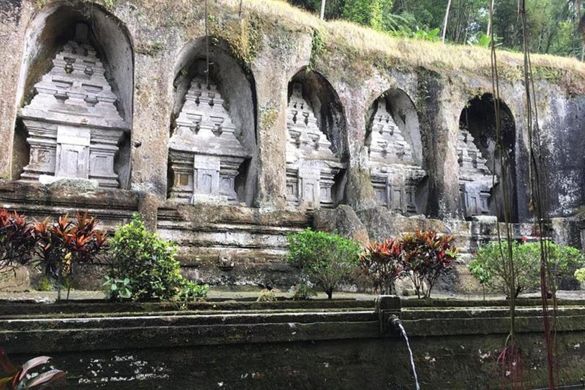 a stone wall with arches on the side of a building