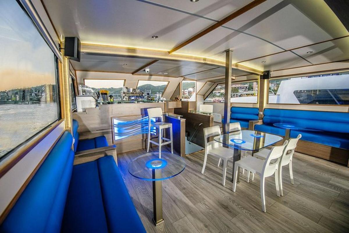 a room with a table and chairs in a boat