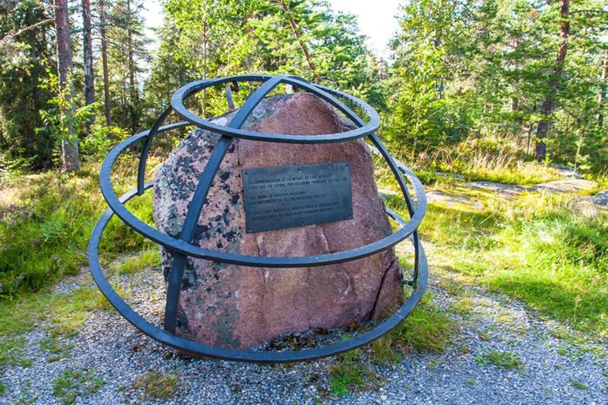 a large rock with a hose on top of it
