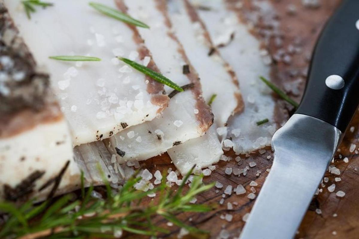 a piece of food with a knife on a table