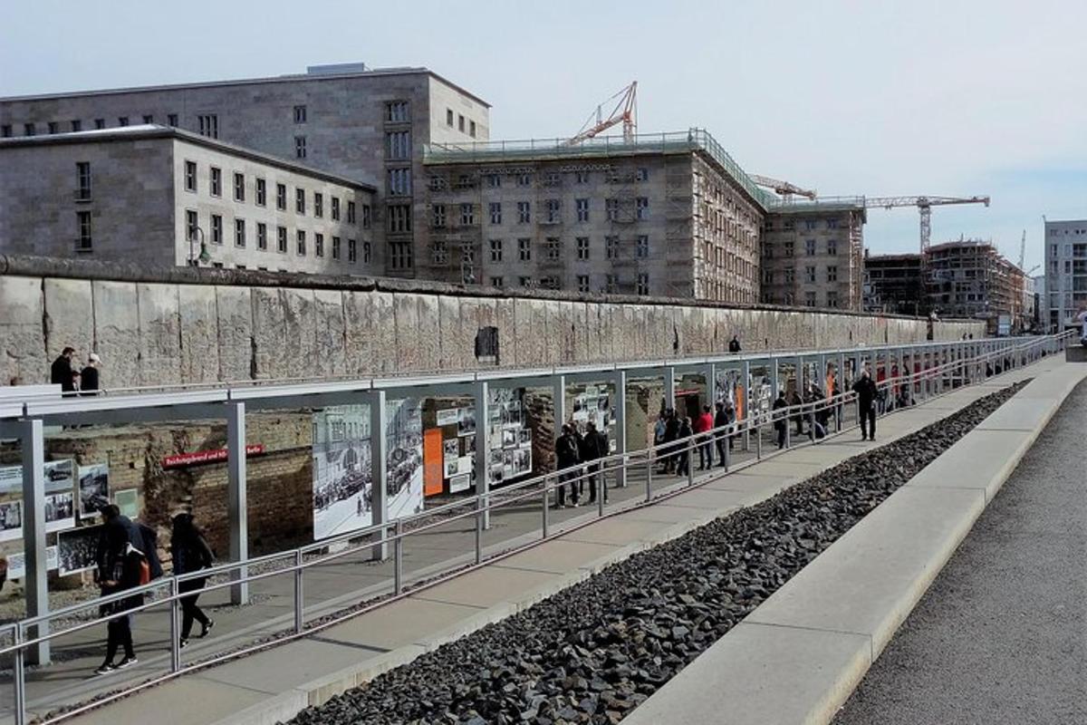 a group of people walking on a train station