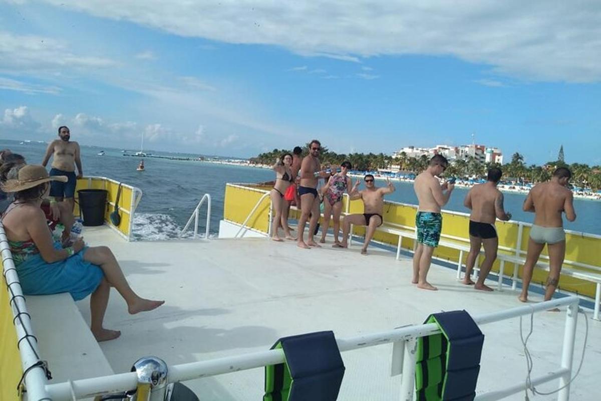a group of people standing on the deck of a boat