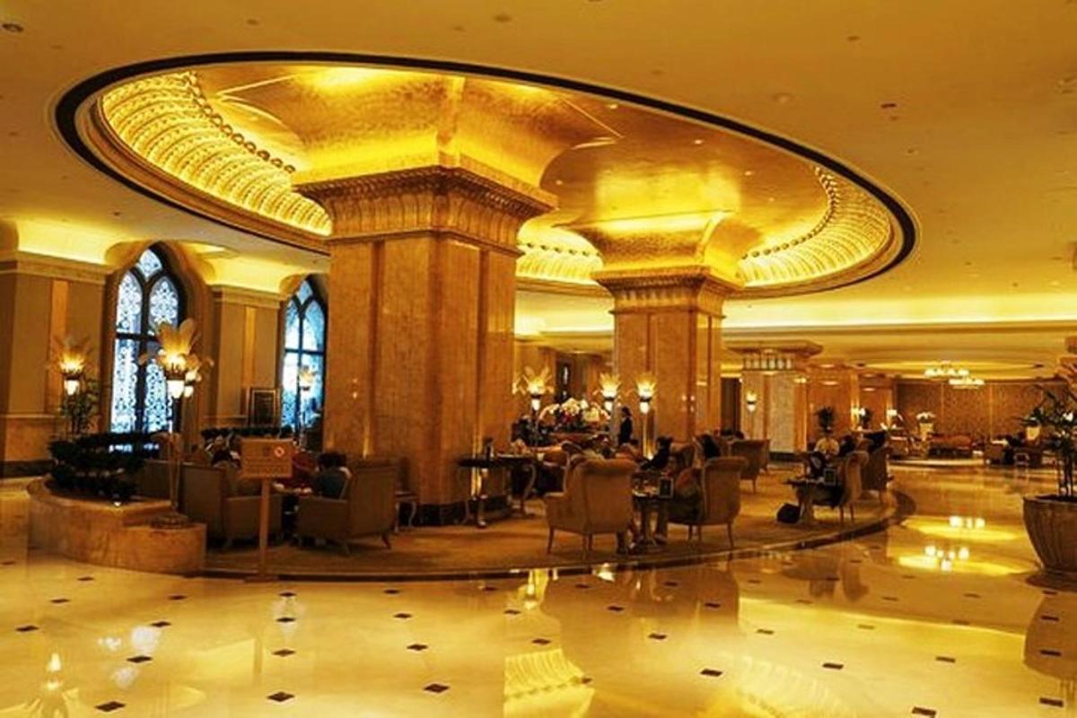 a large lobby with chairs and tables in a building