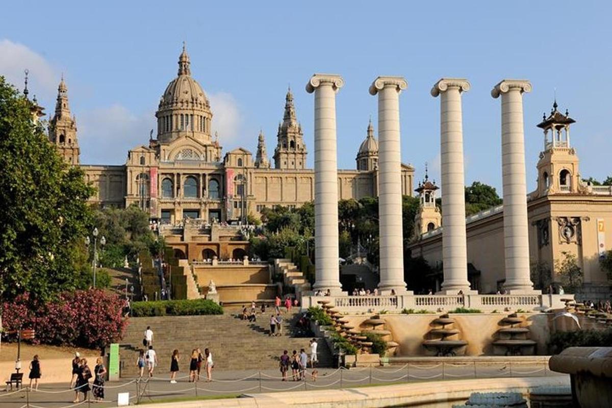 a building with columns and people walking in front of it