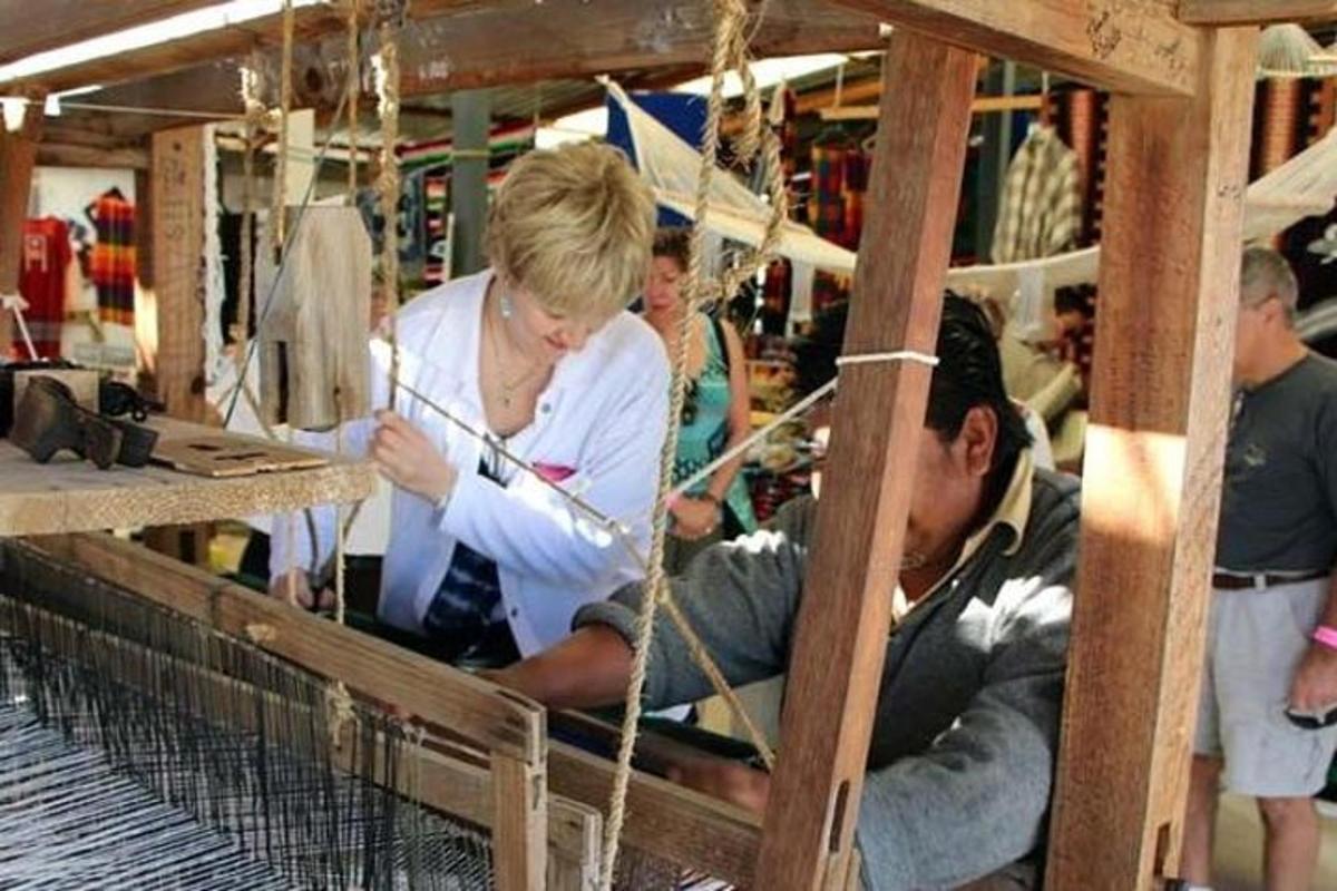 a woman working with a man in a factory