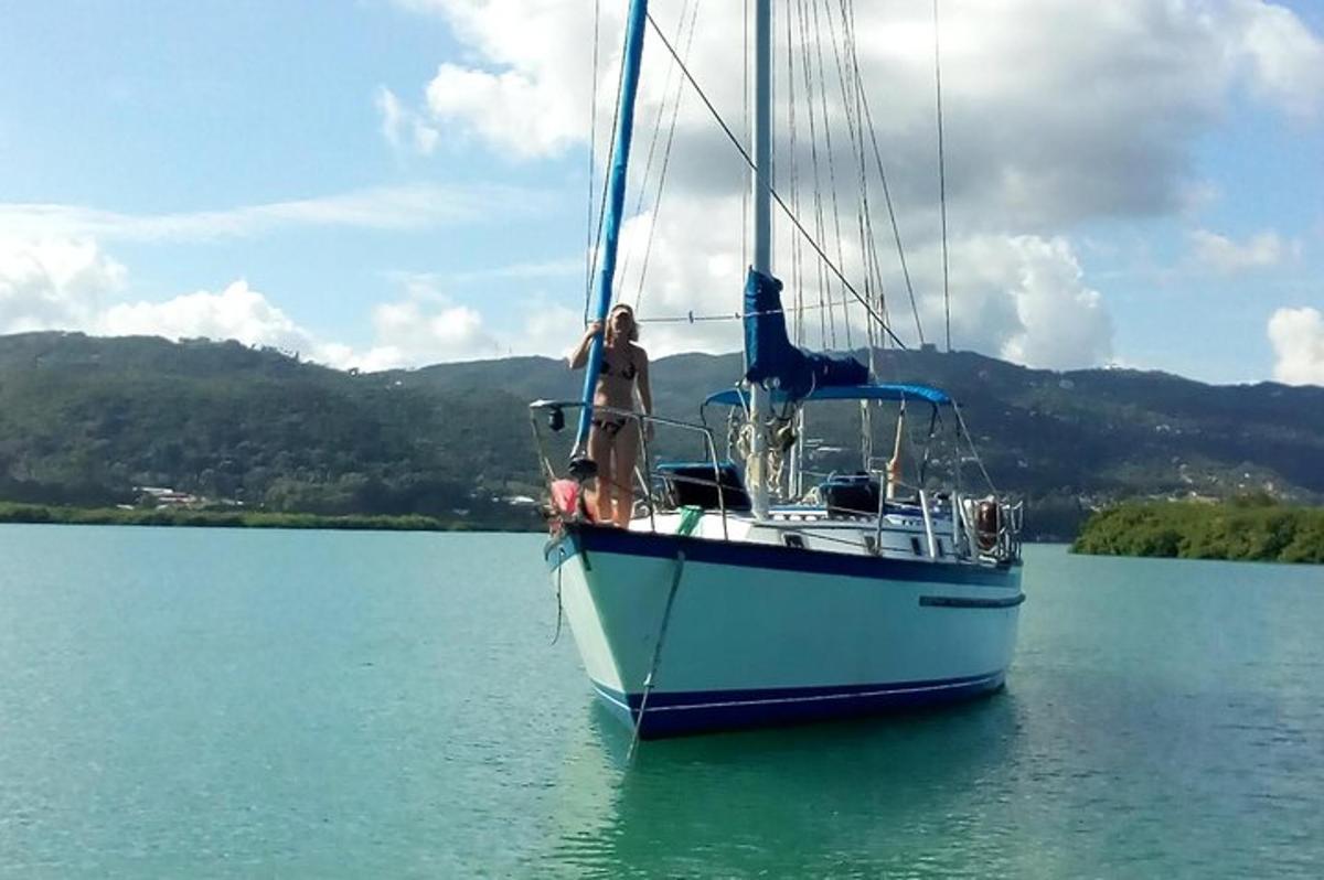two people on a sail boat in the water