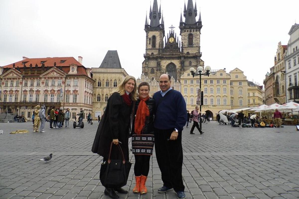 a man and woman posing for a picture in a city