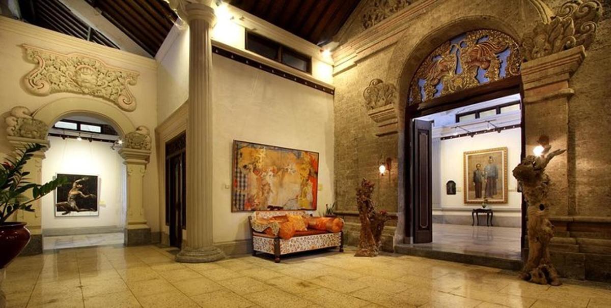 a lobby with a couch in the middle of a building