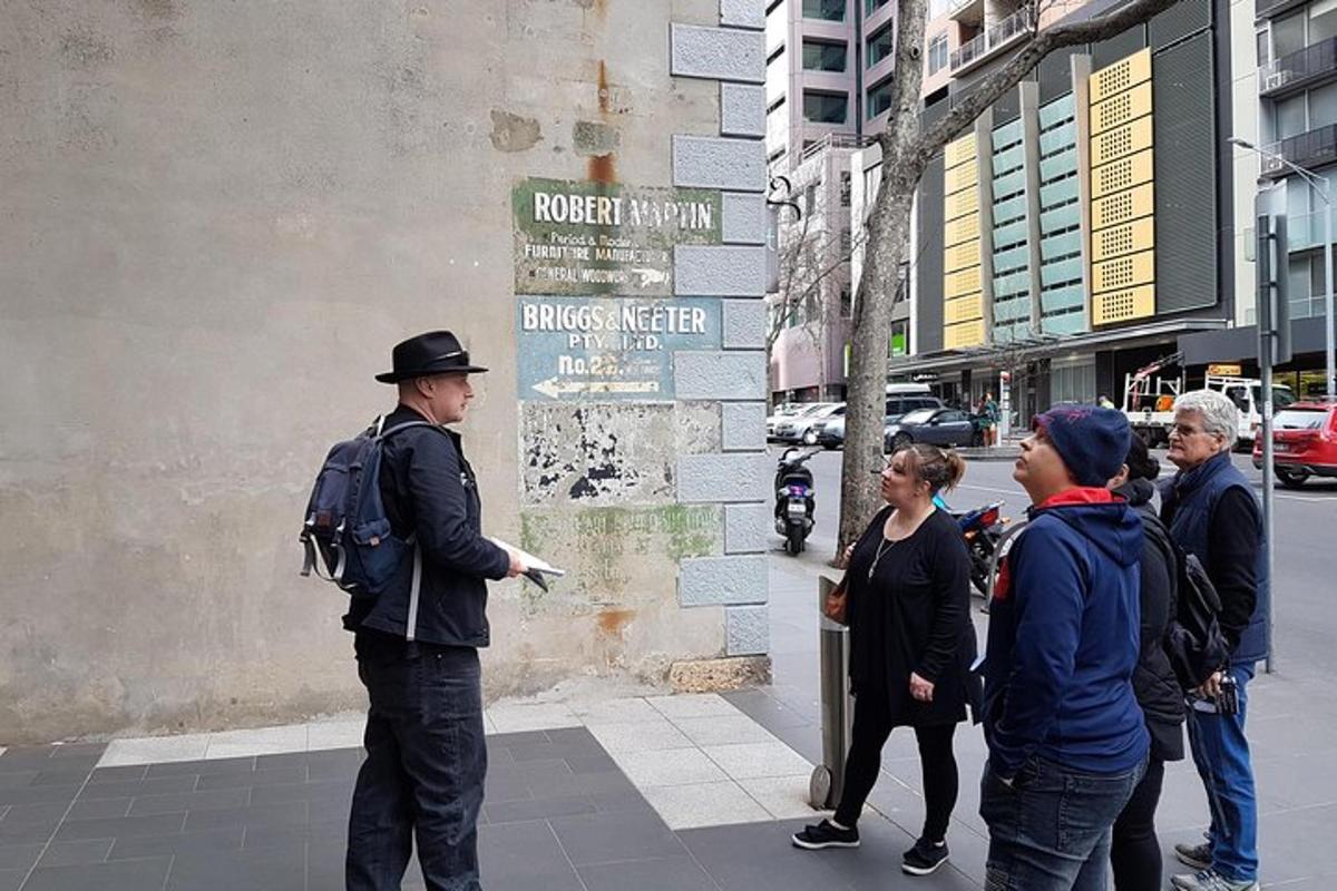a man standing on a street with a group of people