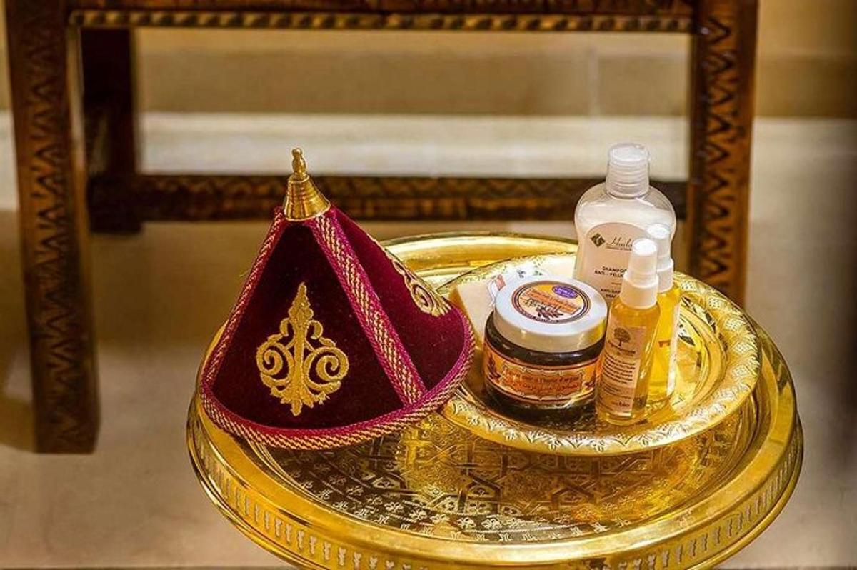 a gold table with two bottles of essential oils on it