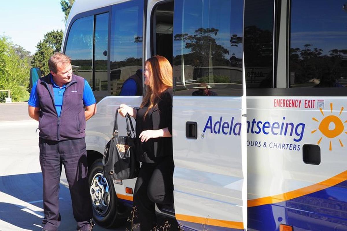 a man and a woman getting on a bus