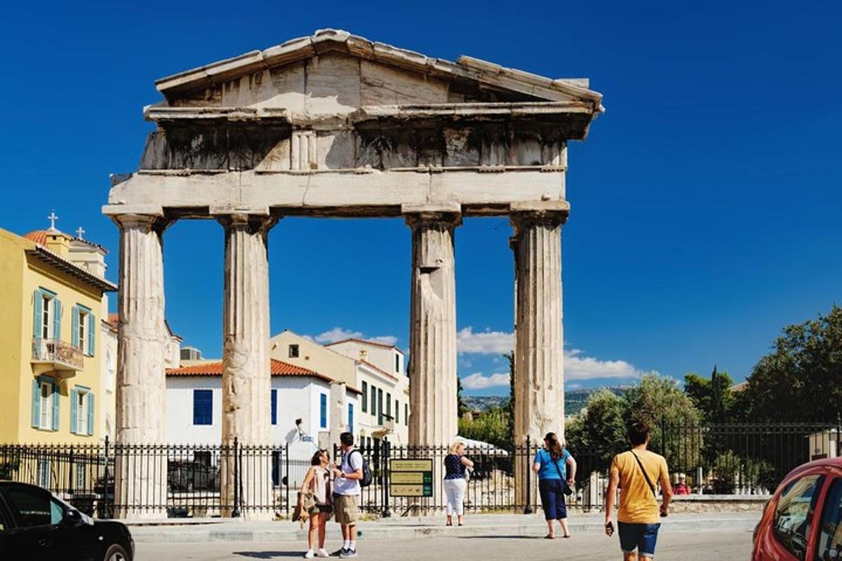 a group of people walking in front of a monument