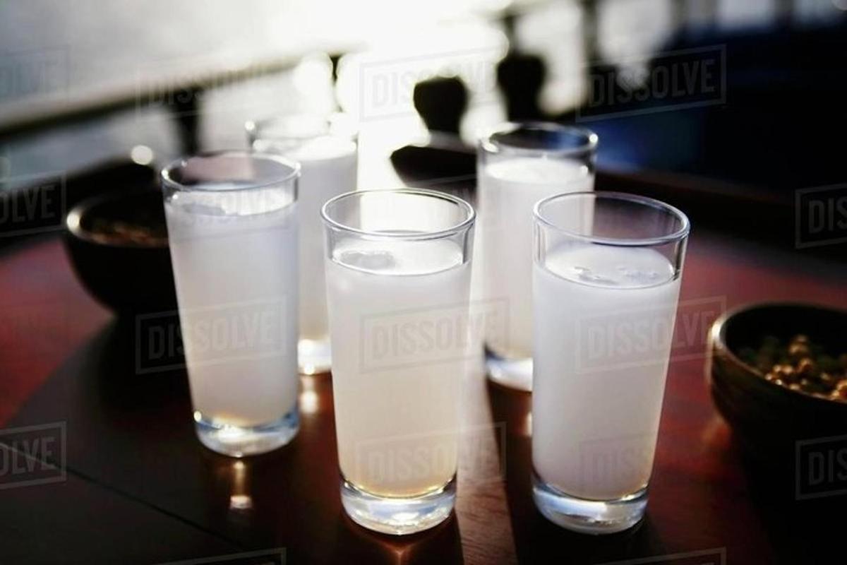 a group of glasses of water on a table
