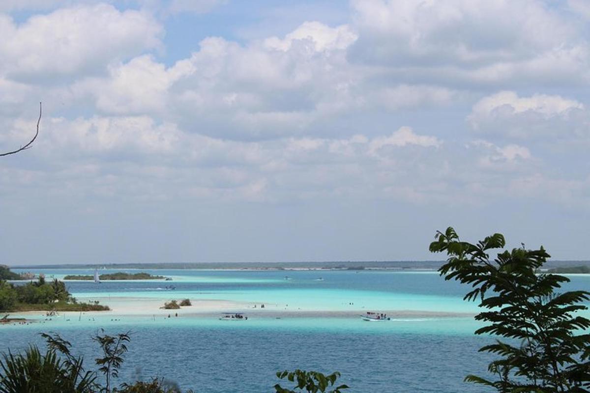 a view of a beach with people in the water