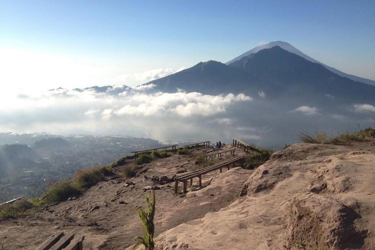 a view of a mountain with clouds in the sky