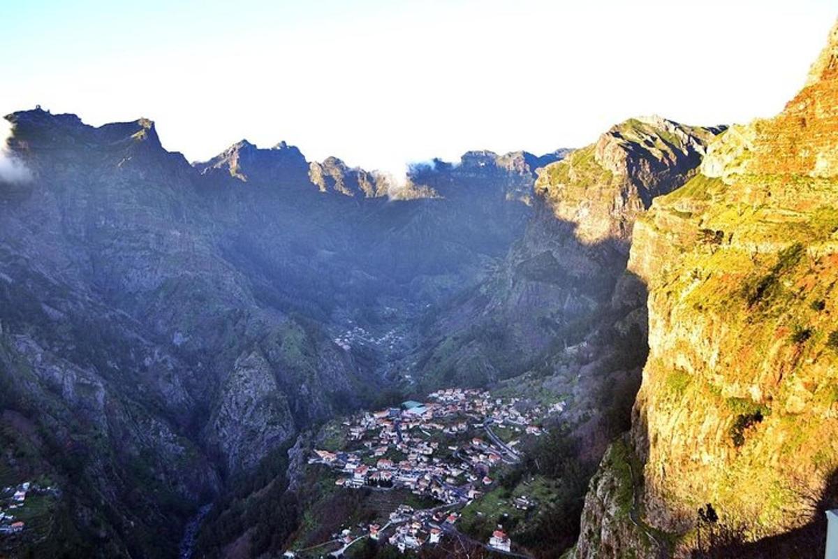 a view of a town in a mountain valley