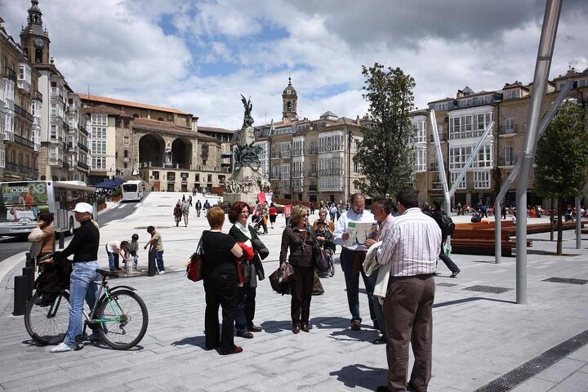 a group of people standing around in a city