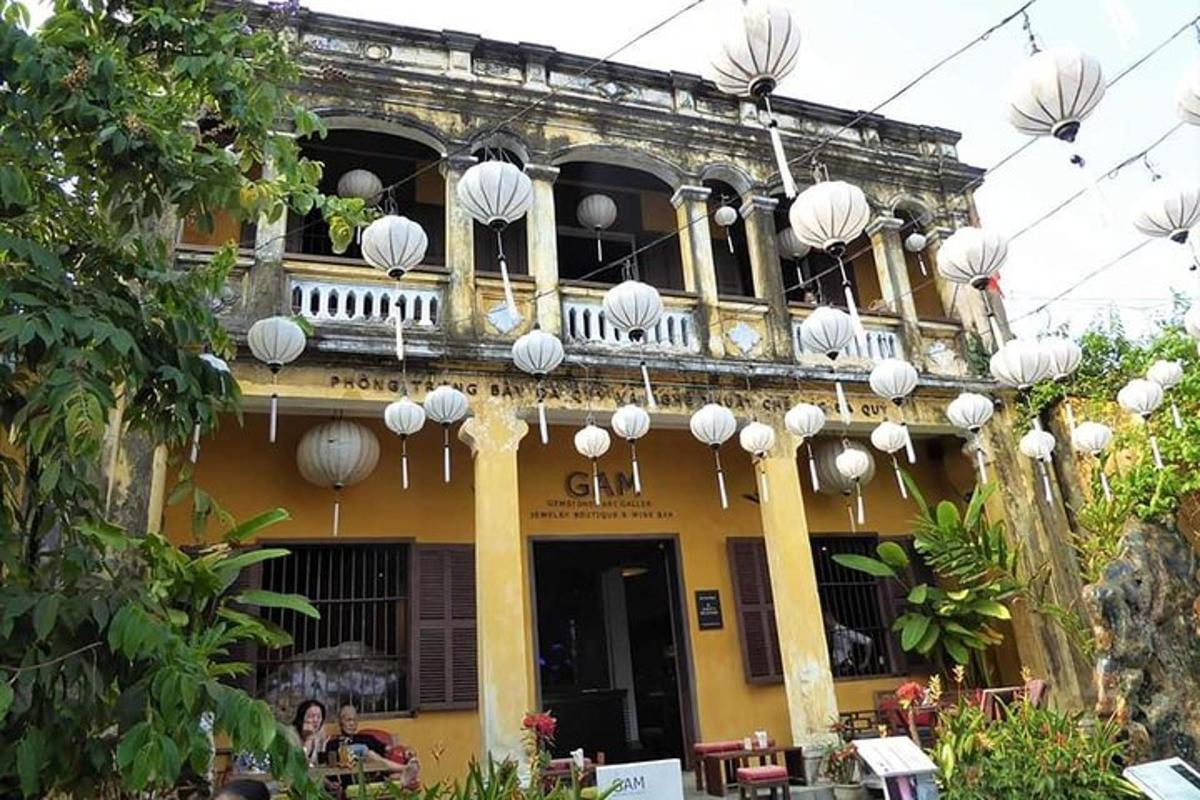 a building with white lanterns on the side of it