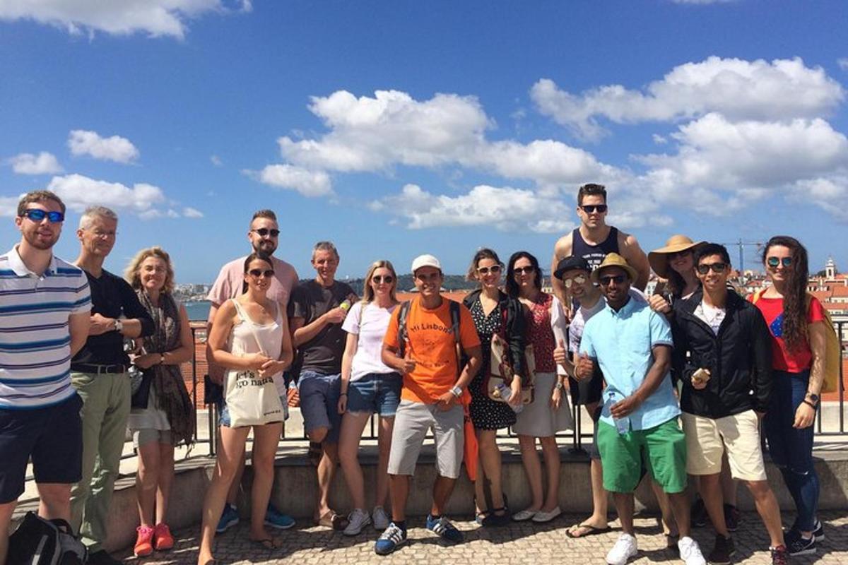 a group of people posing for a picture on a fence