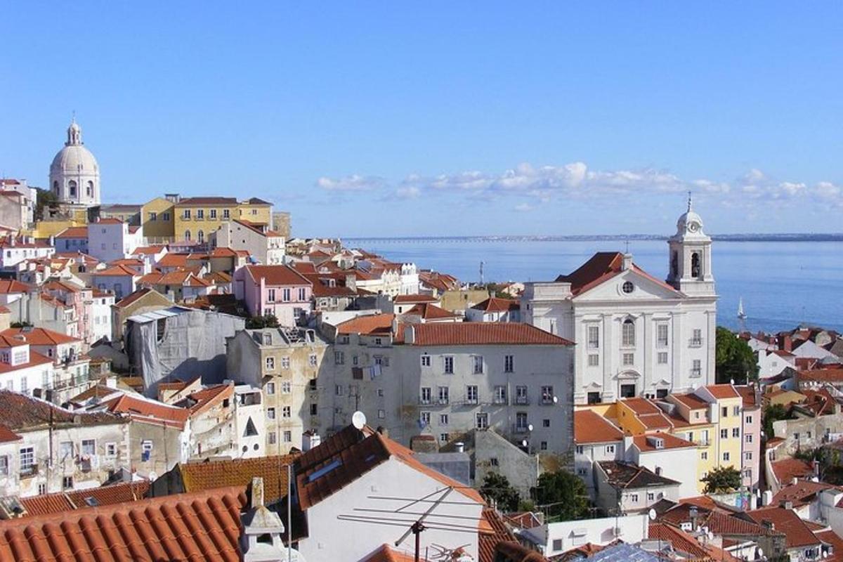 a view of a city with buildings and the water