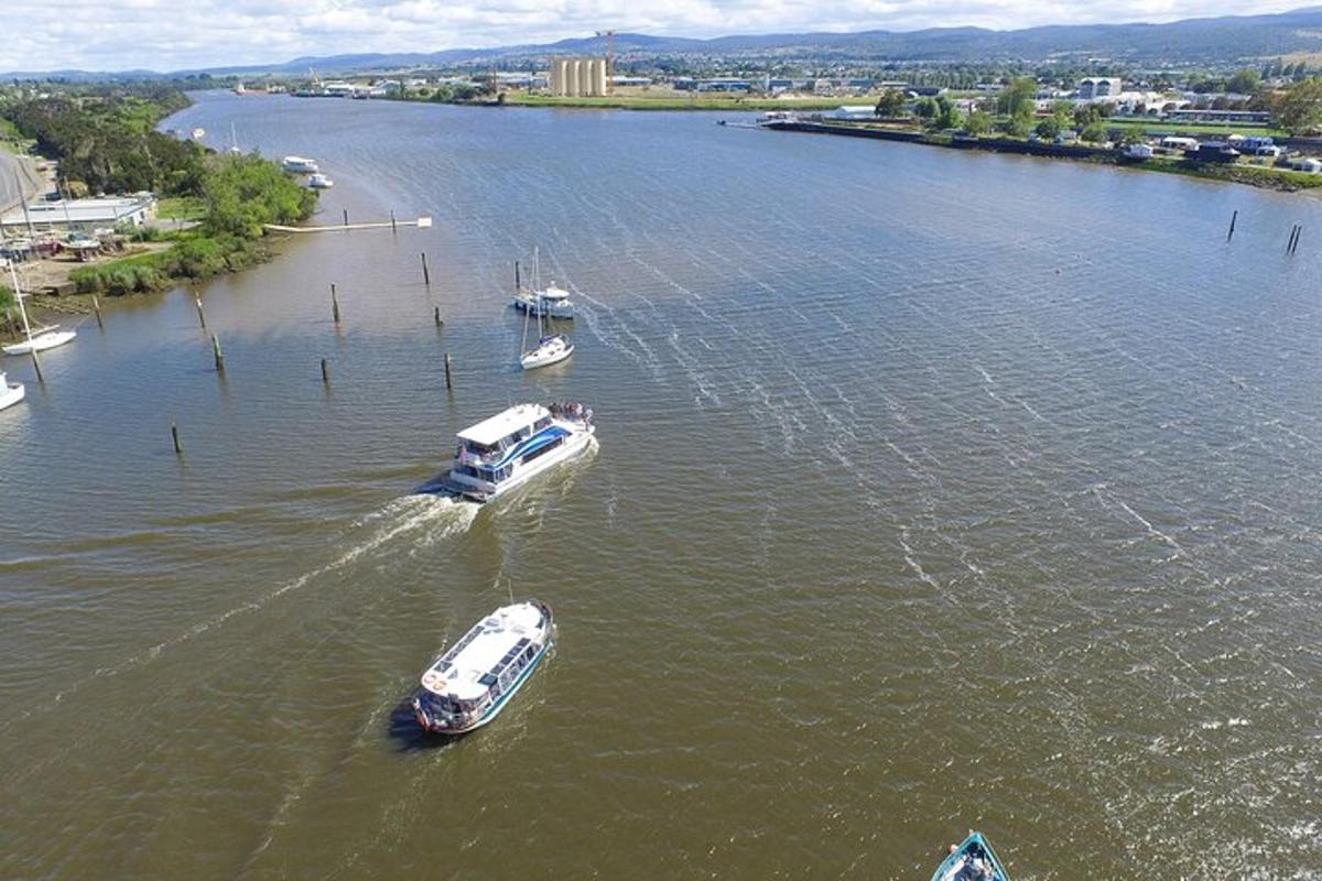 an aerial view of boats in a river
