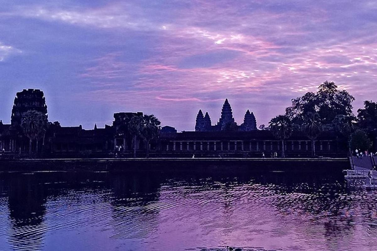 a view of a temple and a body of water