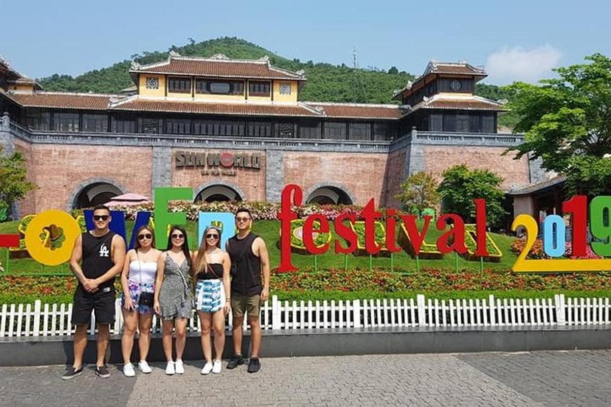 a group of people standing in front of a sign