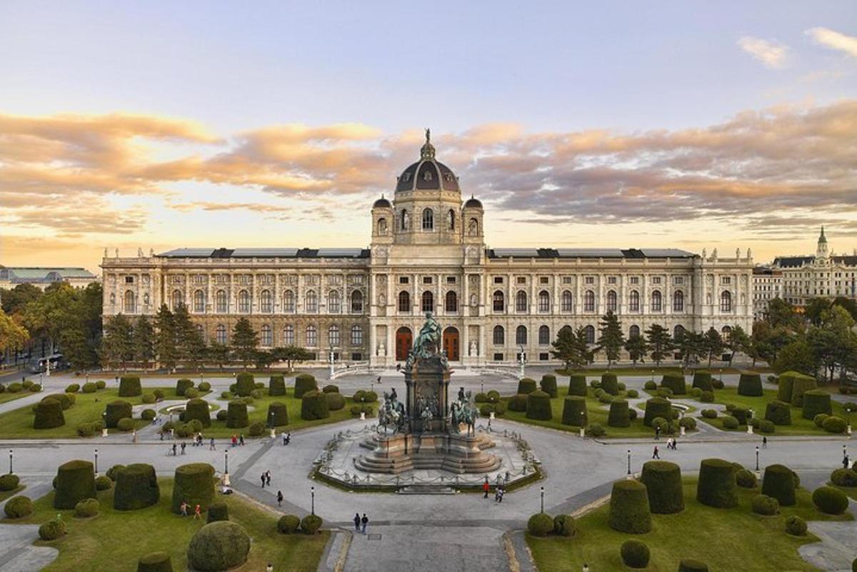 a large building with a fountain in front of it