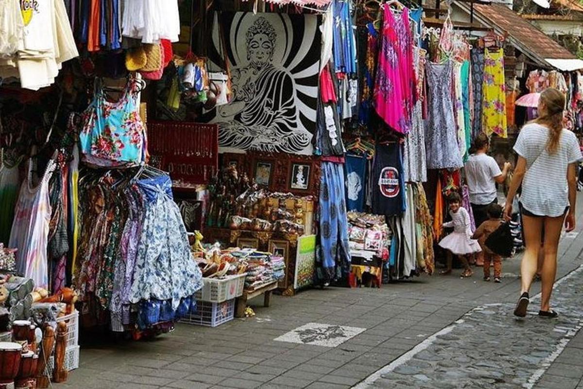 a woman walking down a street in a market