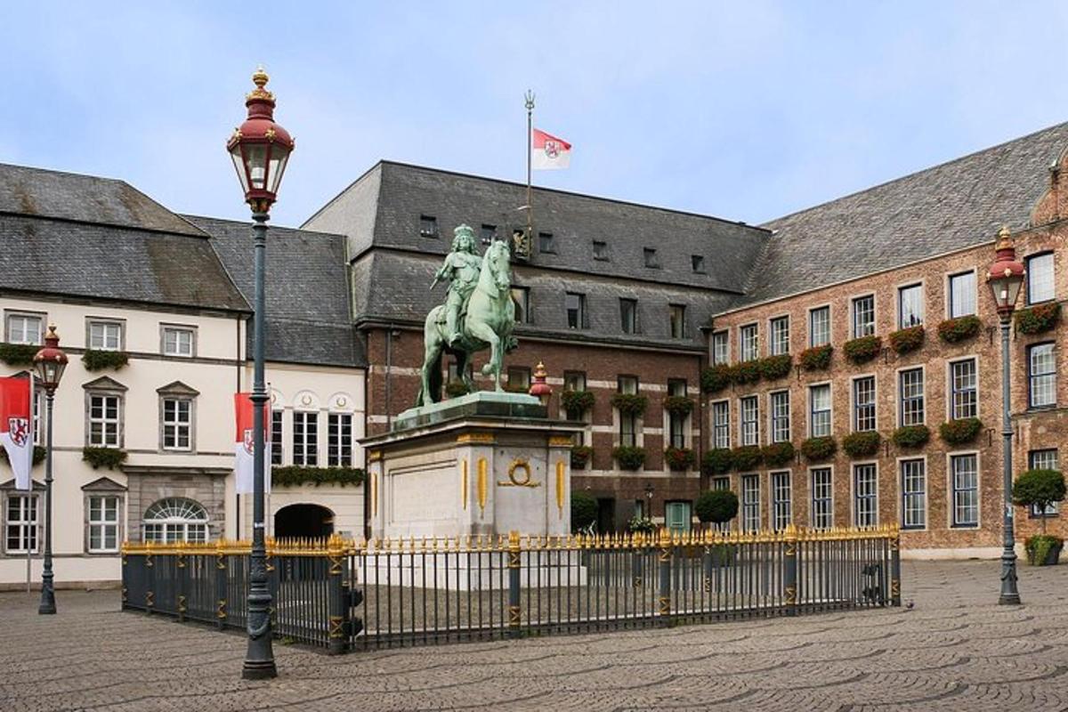 a statue of a man on a horse in front of a building