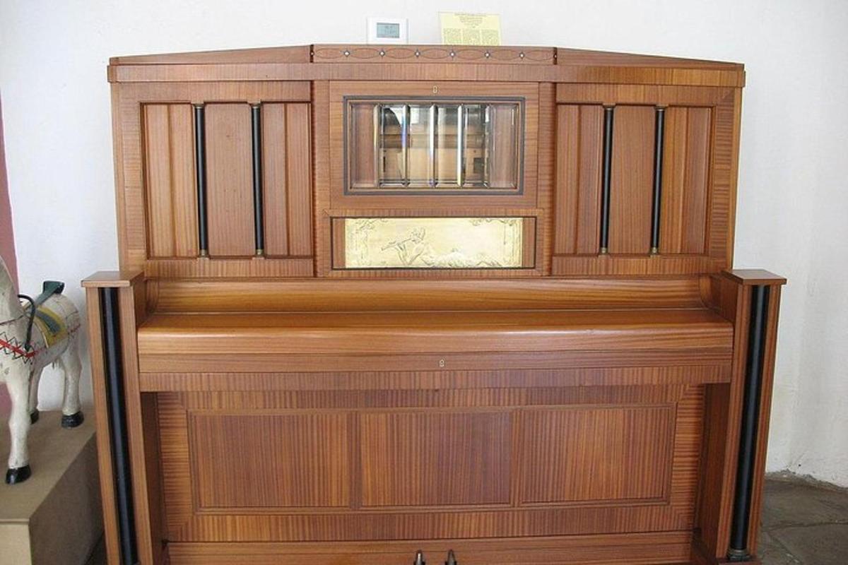 a wooden entertainment center with a window on top