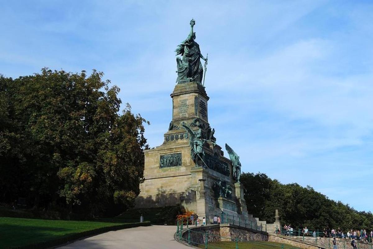 a statue of a woman on top of a monument