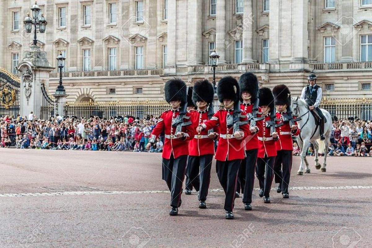 a group of soldiers in red uniforms walking down the street