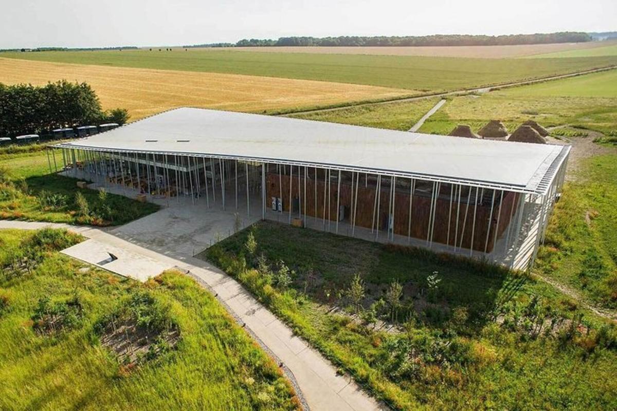 an overhead view of a building in the middle of a field