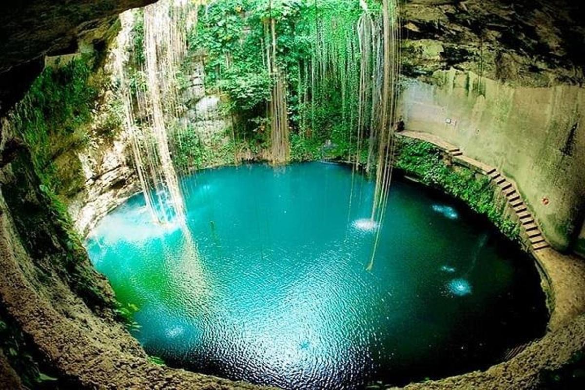 an aerial view of a pool of water with waterfall