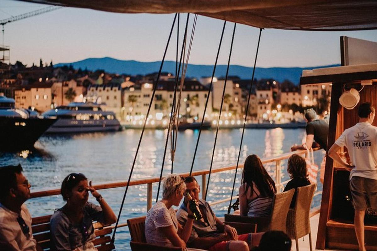 a group of people sitting on a boat in the water