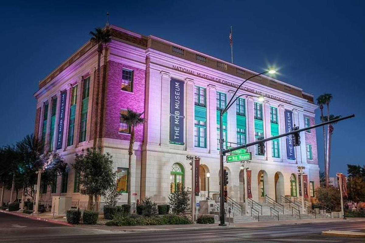a building is lit up in purple and green