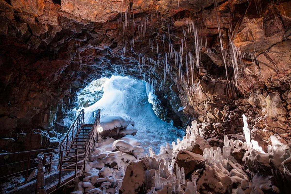 a cave with an ice tunnel with sheep in it