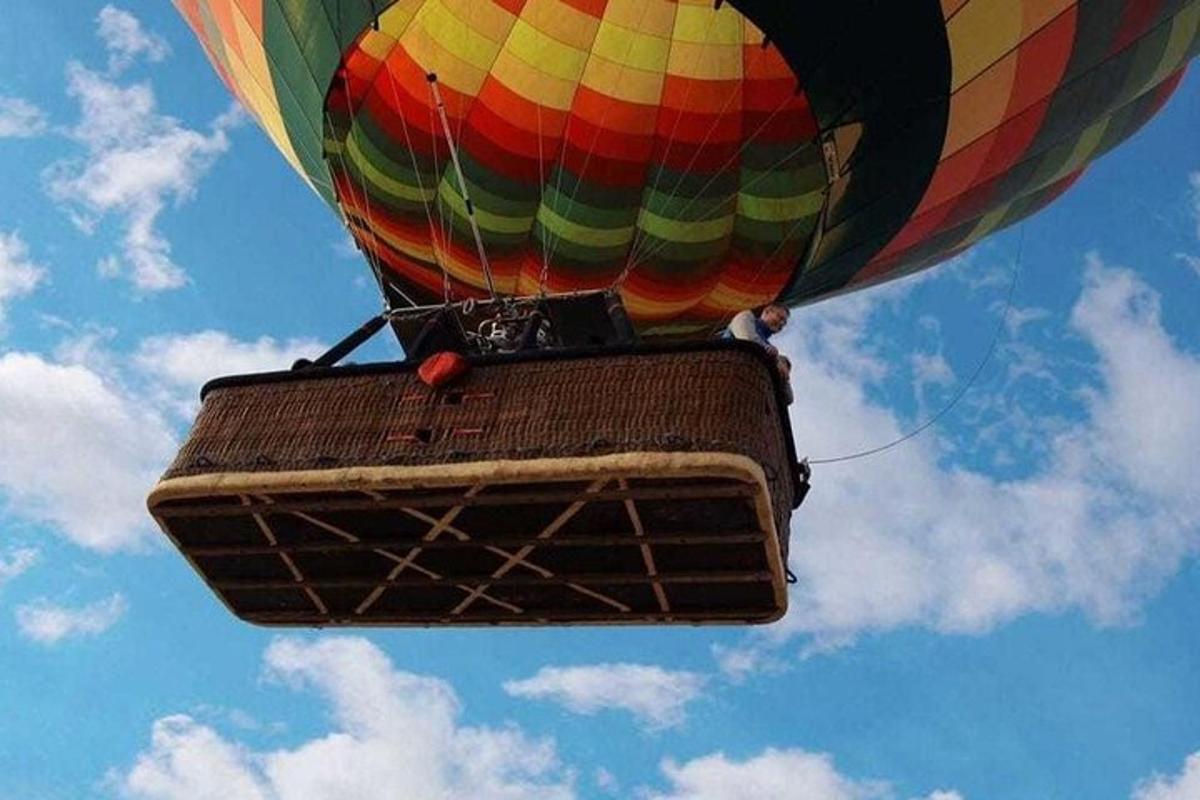 a colorful hot air balloon flying in the sky