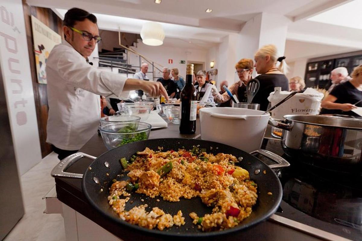 a man in a kitchen with a plate of food