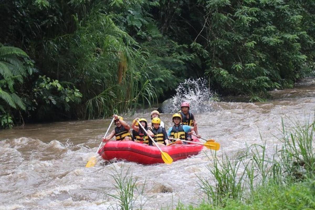 a group of people in a raft in a river