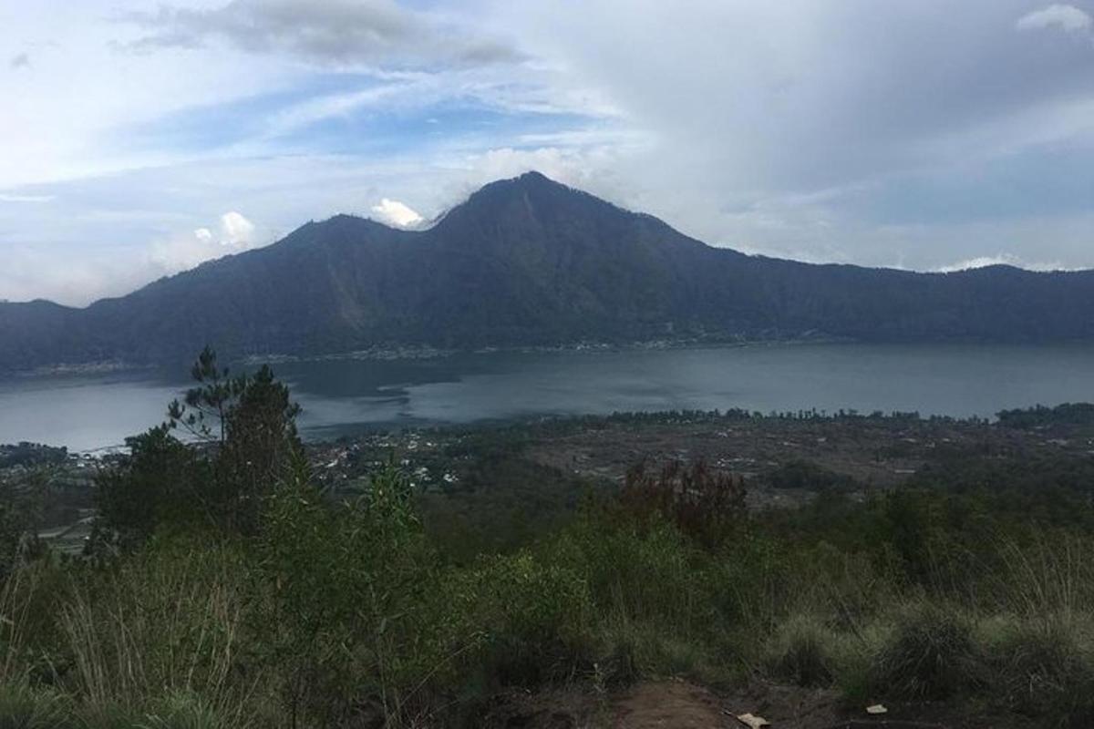 a view of a large body of water with a mountain