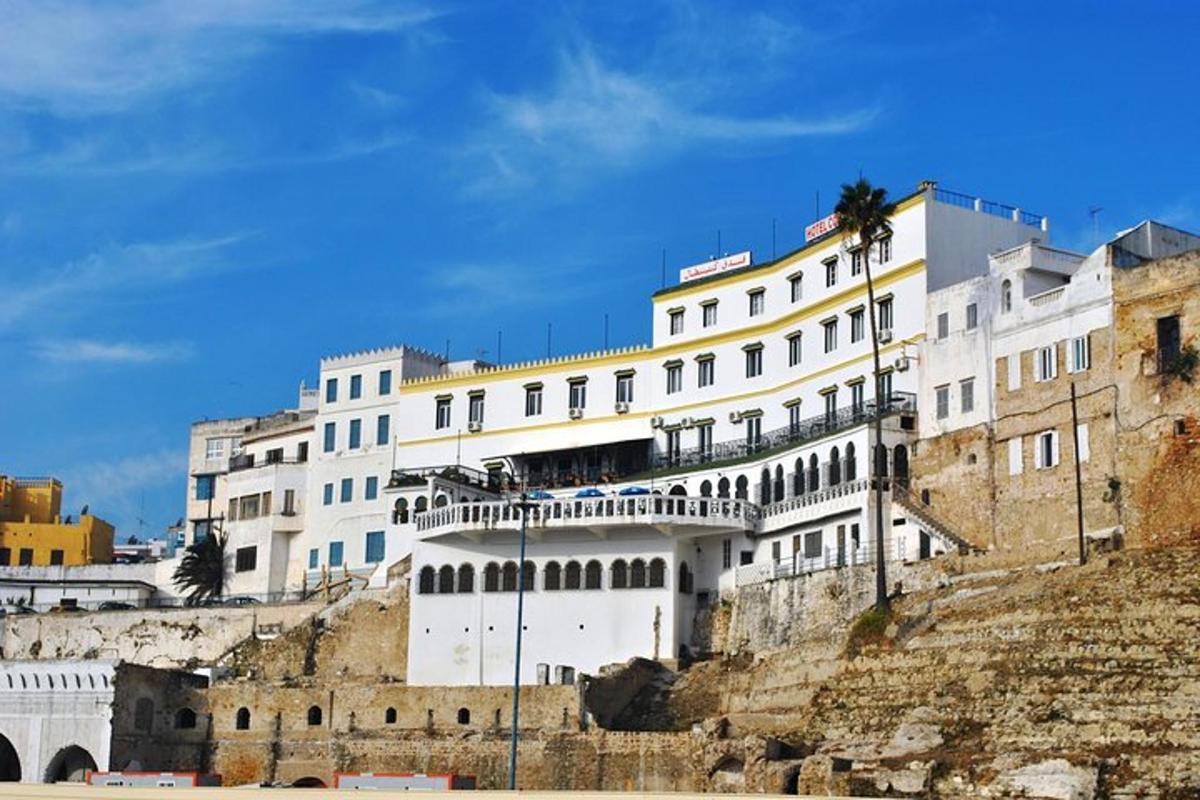 a large white building on the side of a mountain