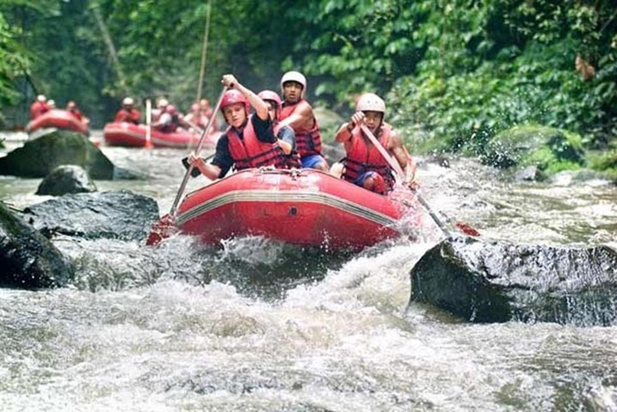 a group of people in a raft in a river