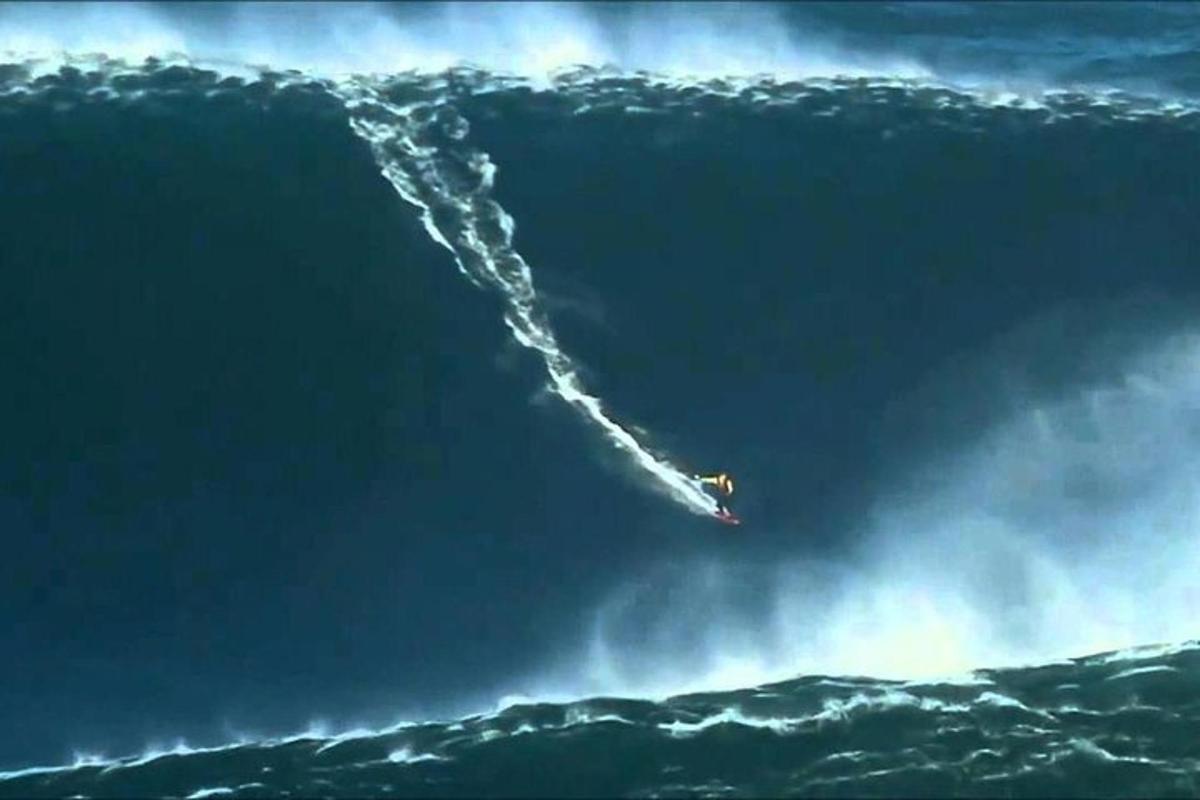 a large wave in the ocean with