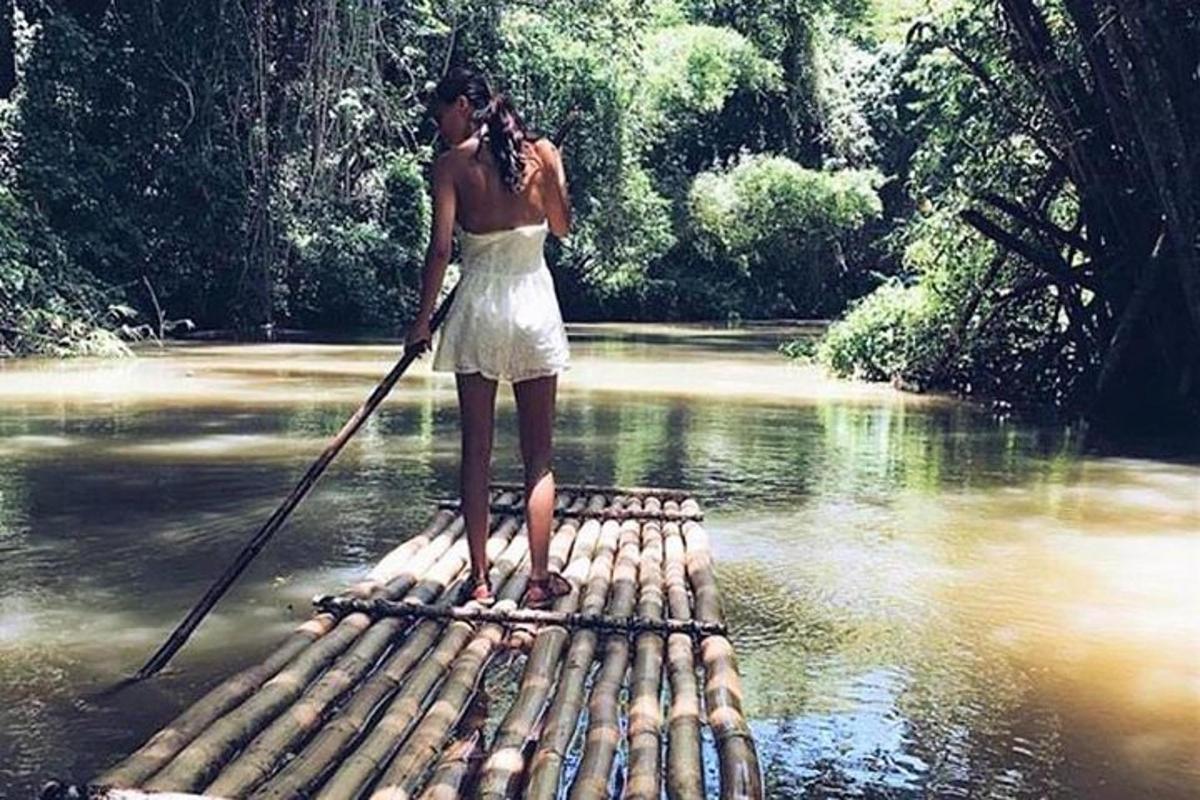 a woman standing on a raft in the water