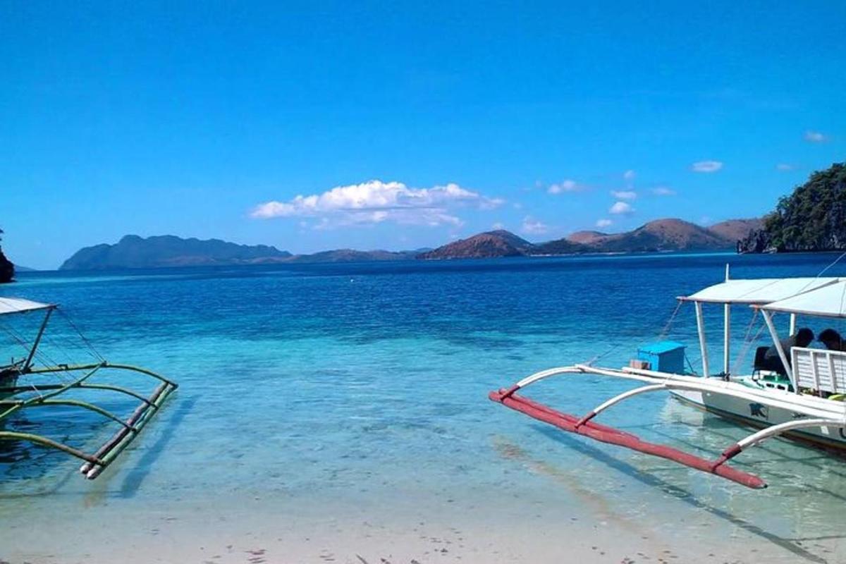 a boat in the water on a beach